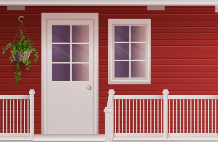 A red house with white windows and a white fence.
