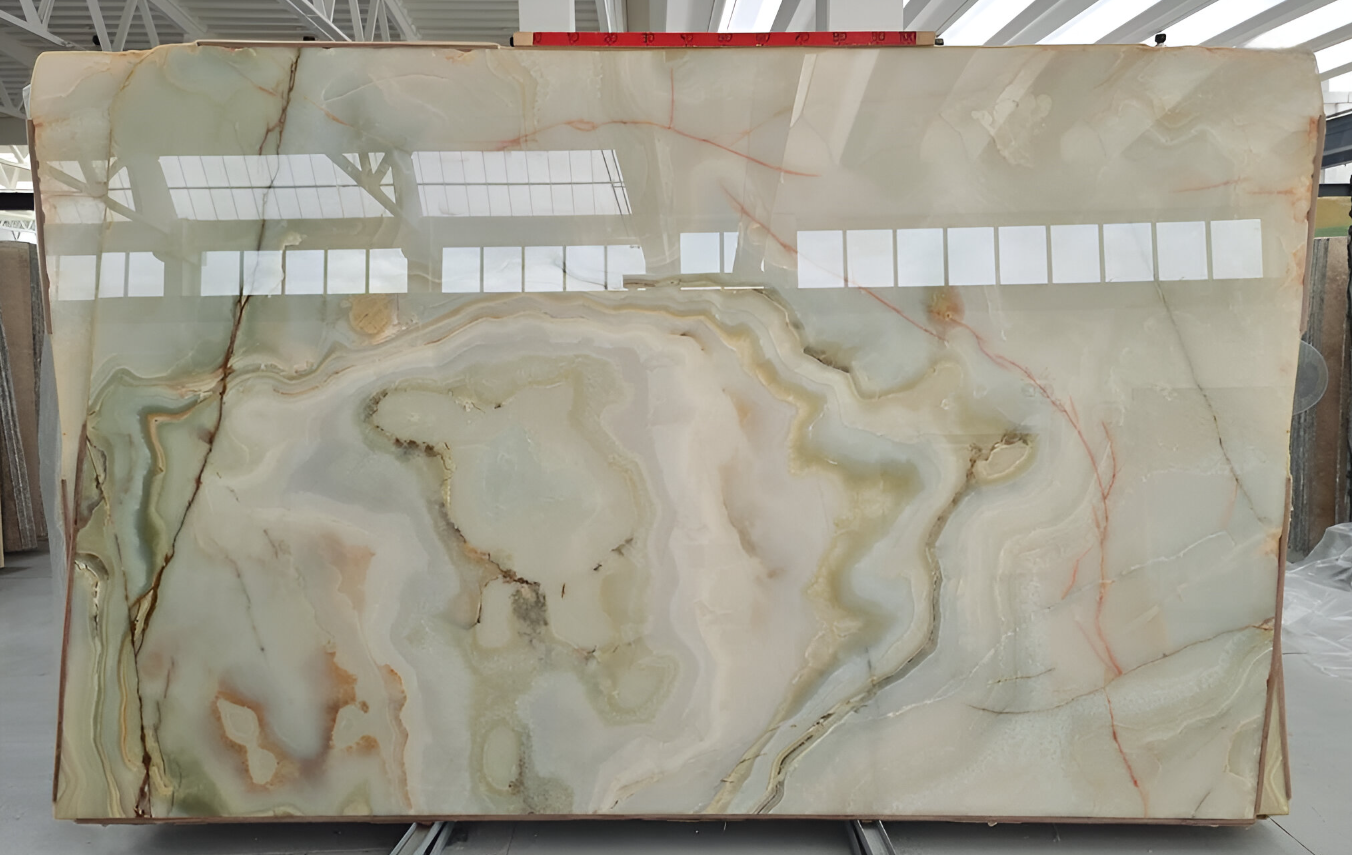 Large marble slab with intricate green and white design.