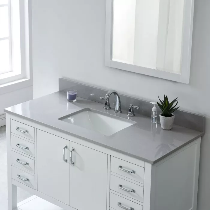 White bathroom vanity with sink and mirror, modern design.