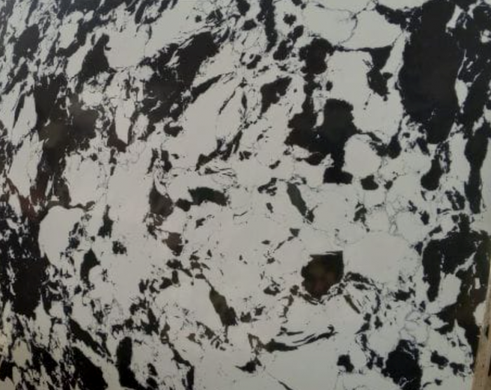 A large black and white marble slab with intricate patterns.