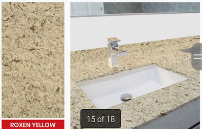 A bathroom counter with a sink and smooth countertop.