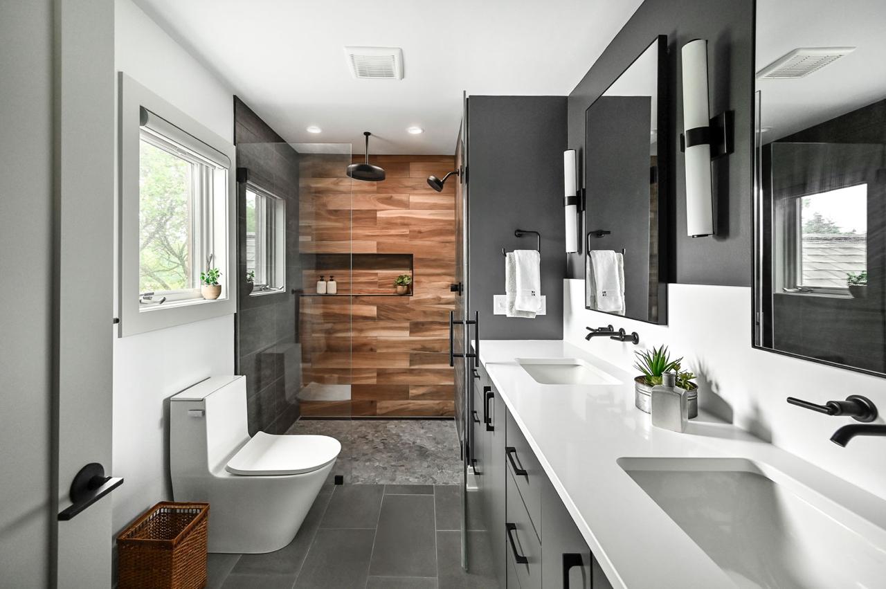 A modern bathroom with a stylish wood-paneled wall, exuding a serene atmosphere.